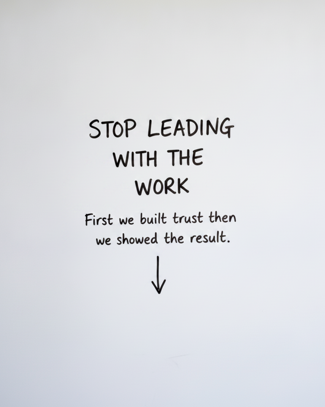 Whiteboard with the words Stop leading with the work written in black marker above a downward arrow