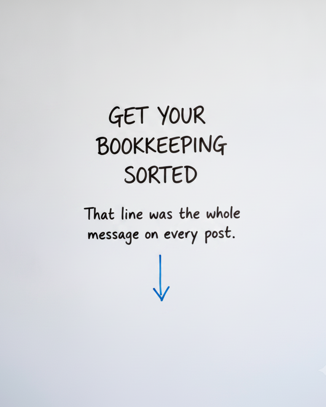 Whiteboard with the words Get your bookkeeping sorted written in black marker above a blue downward arrow