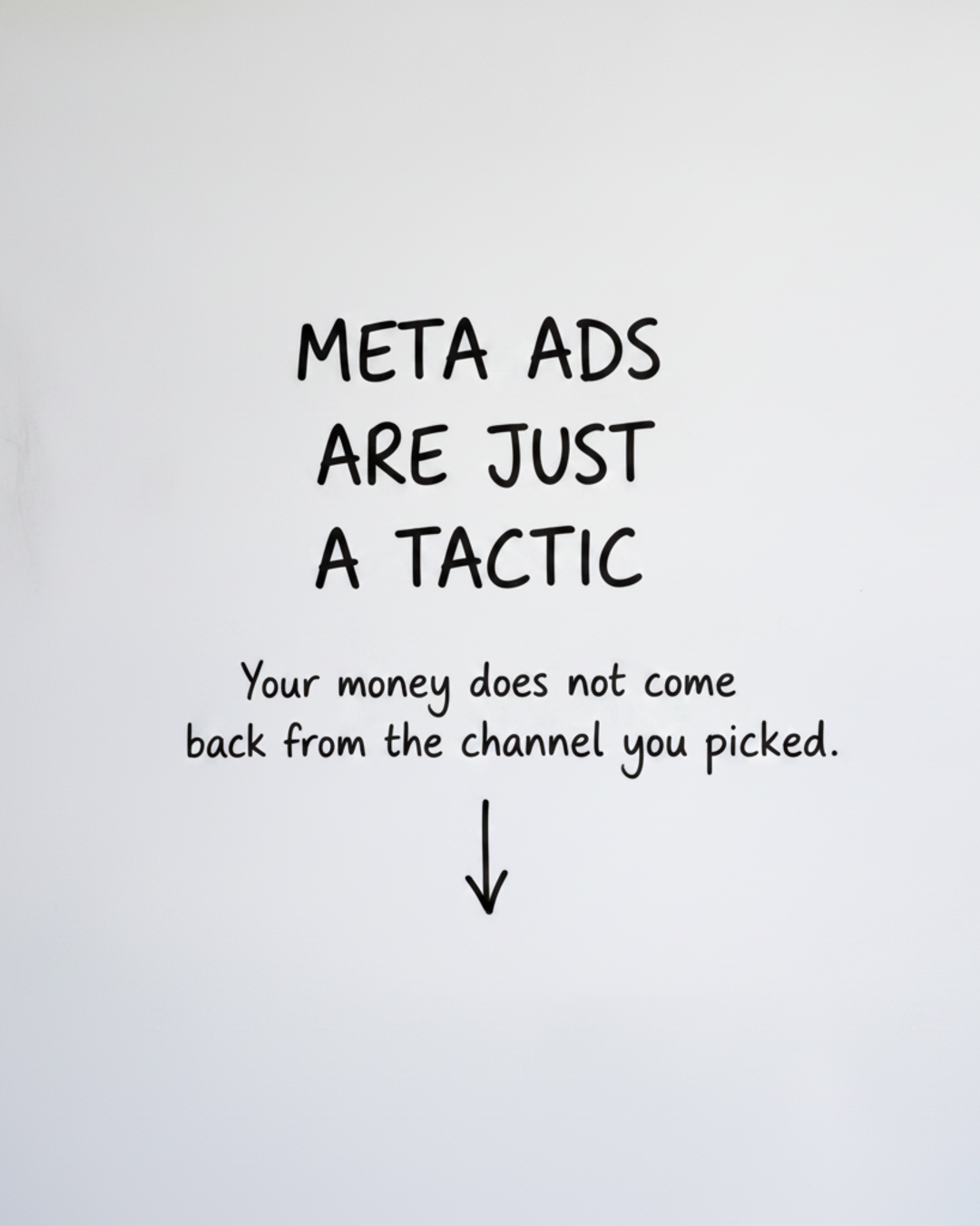 Whiteboard with the words META ADS ARE JUST A TACTIC written in black marker above a short downward arrow
