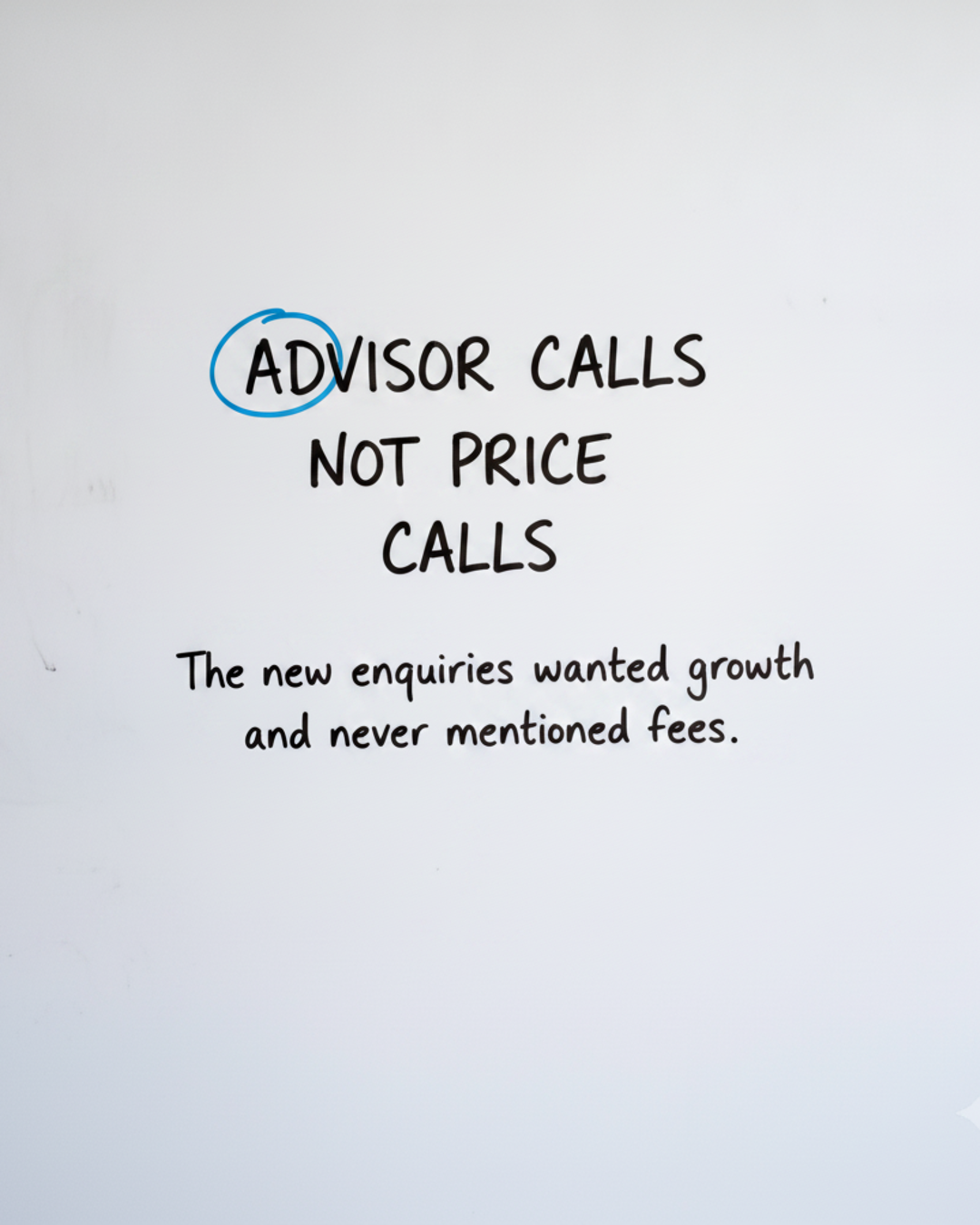 Whiteboard with the words Advisor calls not price calls, with the word ADVISOR circled in blue marker