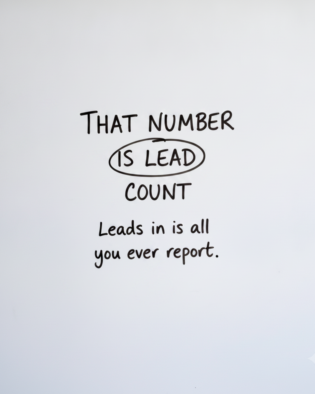 Whiteboard with the words That number is lead count written in black marker, with a circle drawn around the word count
