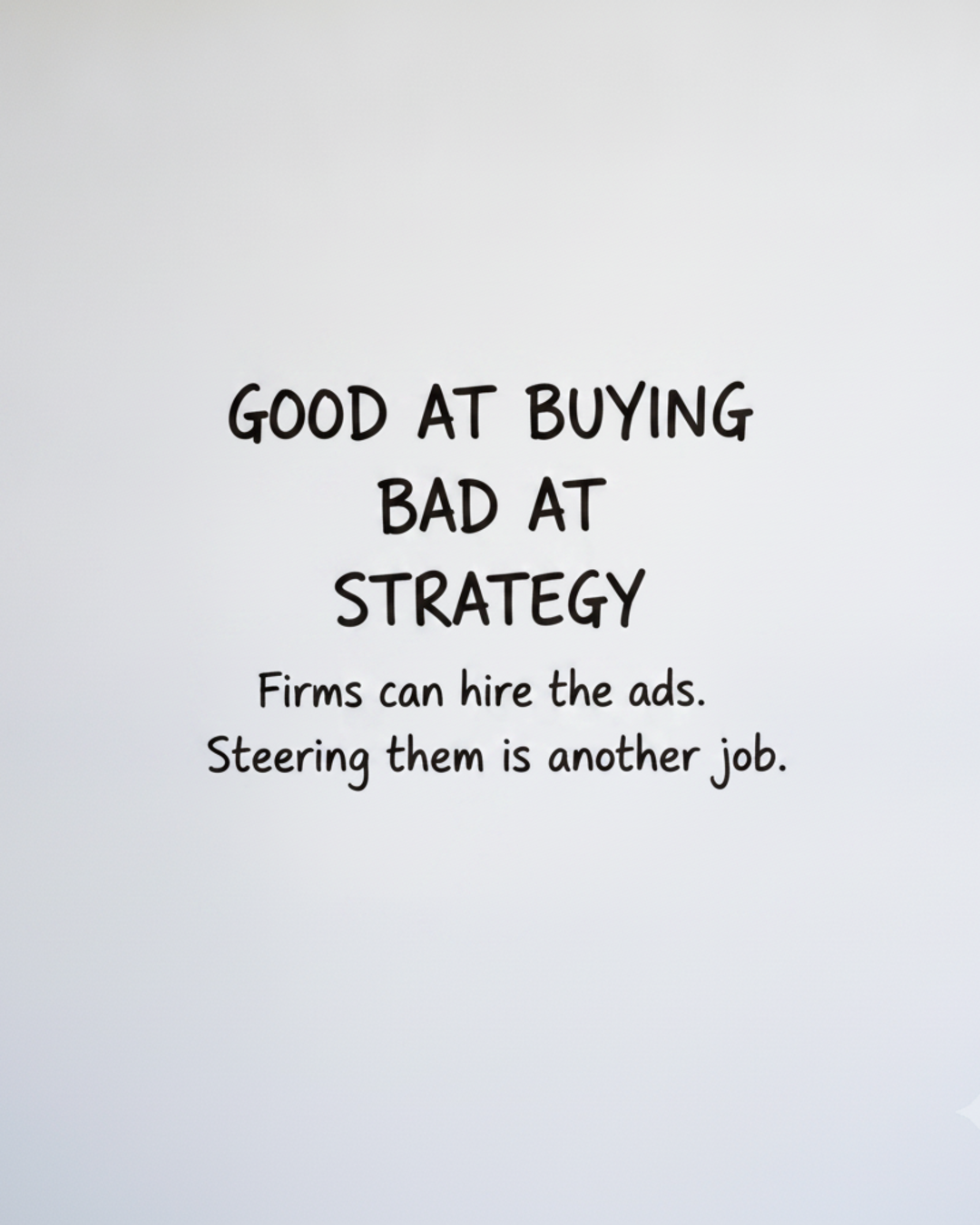 Whiteboard with the words Good at buying, bad at strategy written in black marker