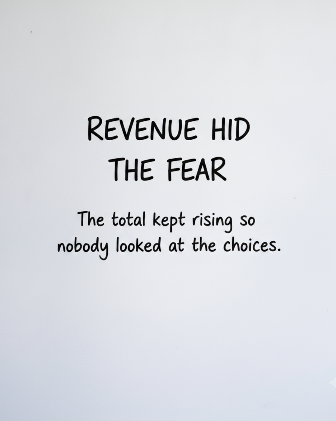 Whiteboard with the words Revenue hid the fear written in black marker