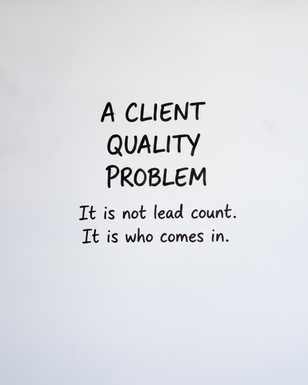 Whiteboard with the words A client quality problem in black marker and the word Quality circled in red