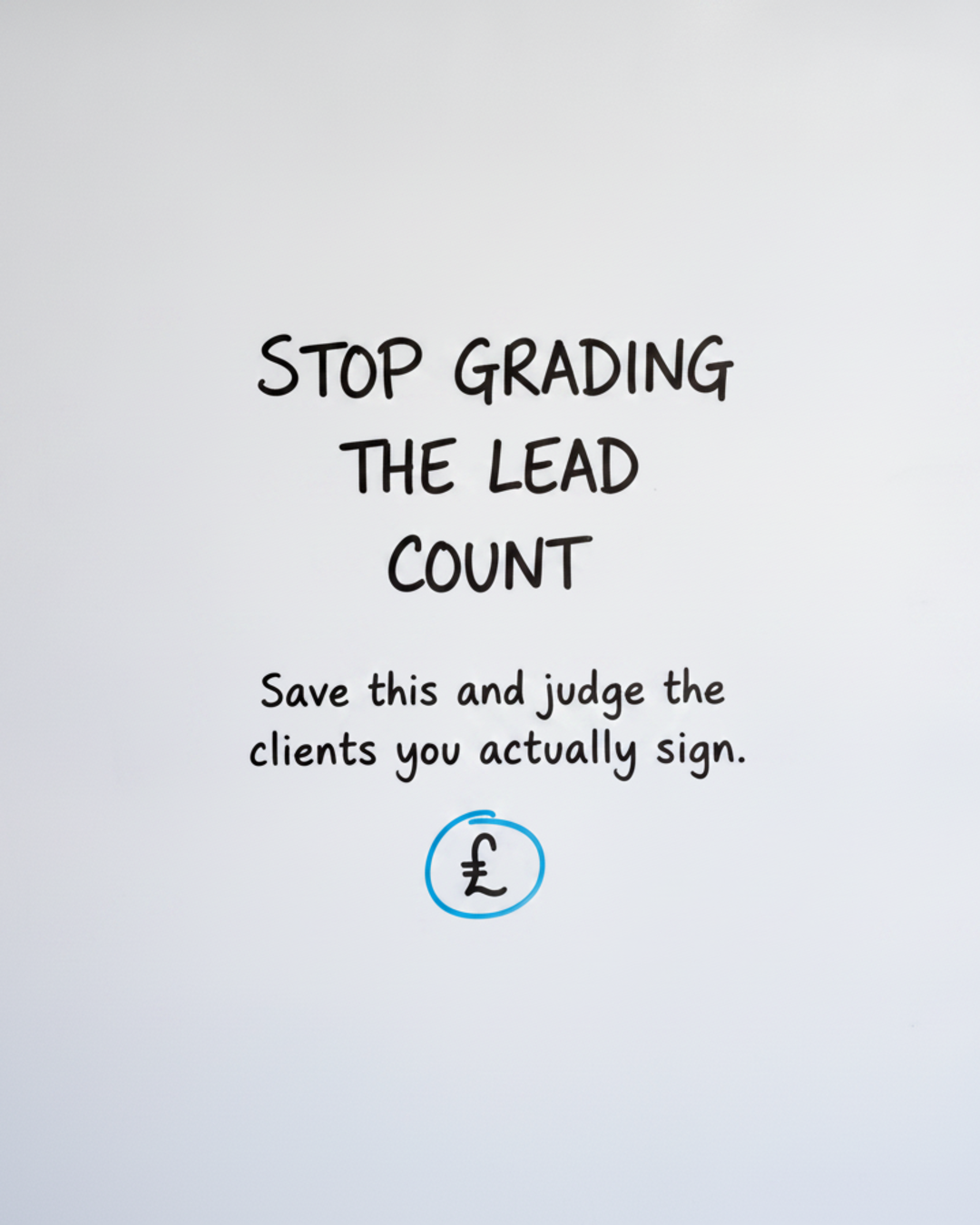 Whiteboard with the words STOP GRADING THE LEAD COUNT written in black marker, with the word COUNT circled in blue