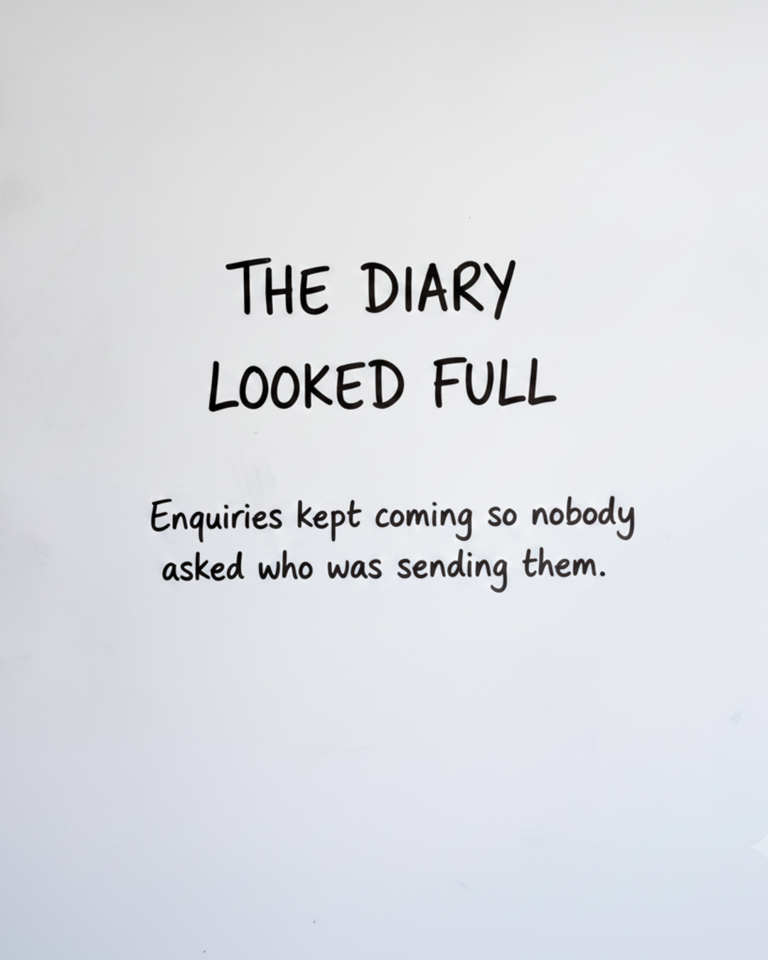 Whiteboard with the words The diary looked full written in black marker