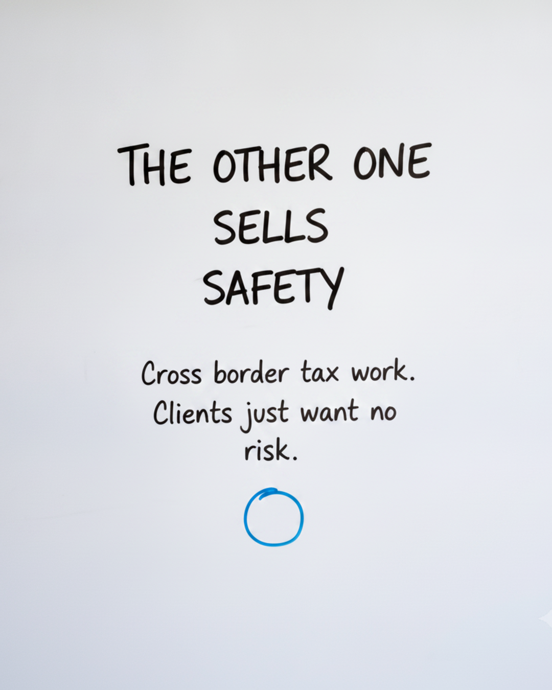 Whiteboard with the words The other one sells safety written in black marker above a blue circle
