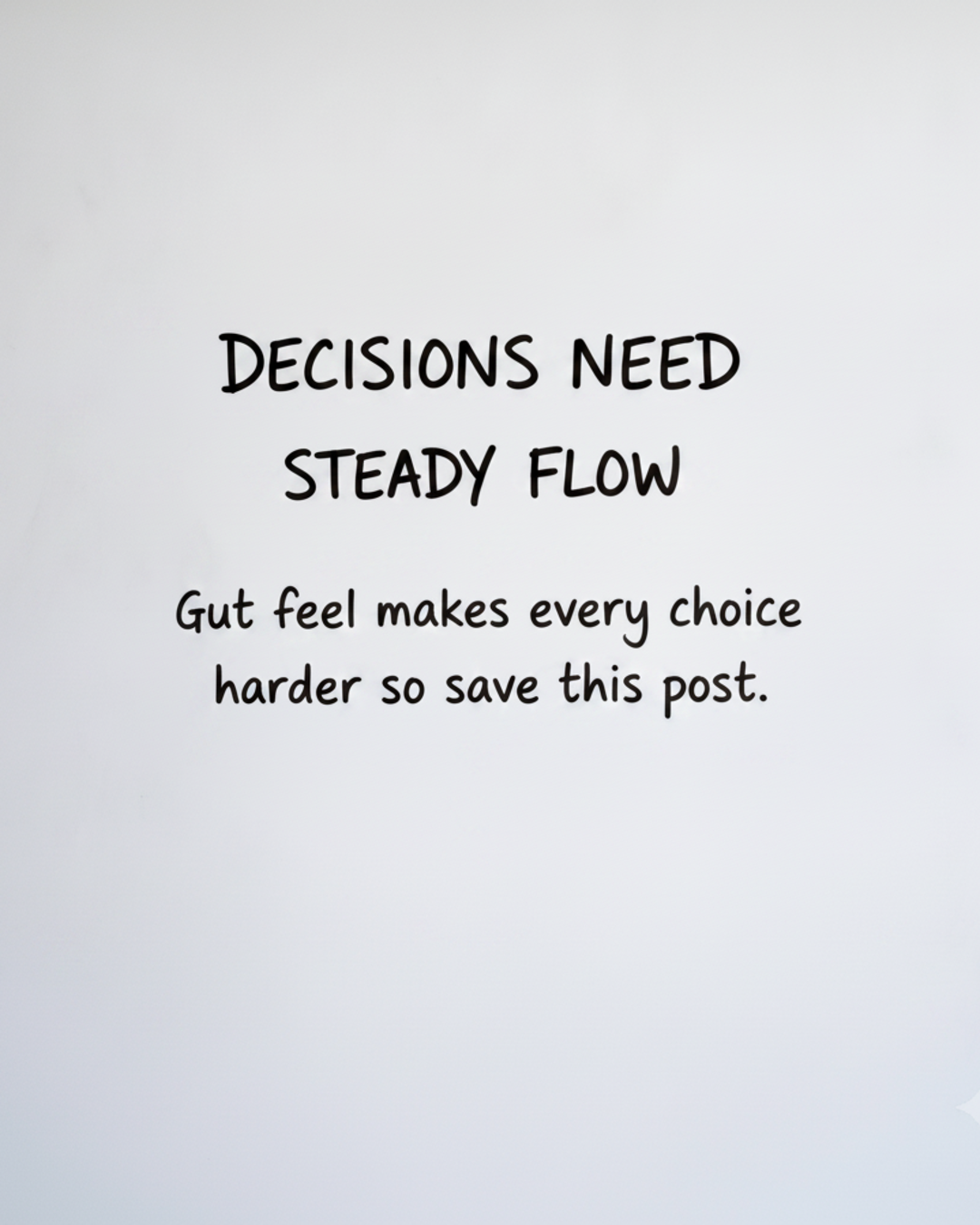 Whiteboard with the words Decisions need steady flow written in black marker