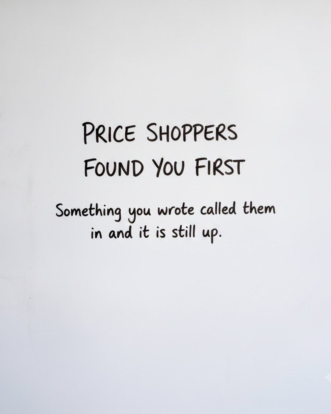 Whiteboard with the words Price shoppers found you first written in black marker