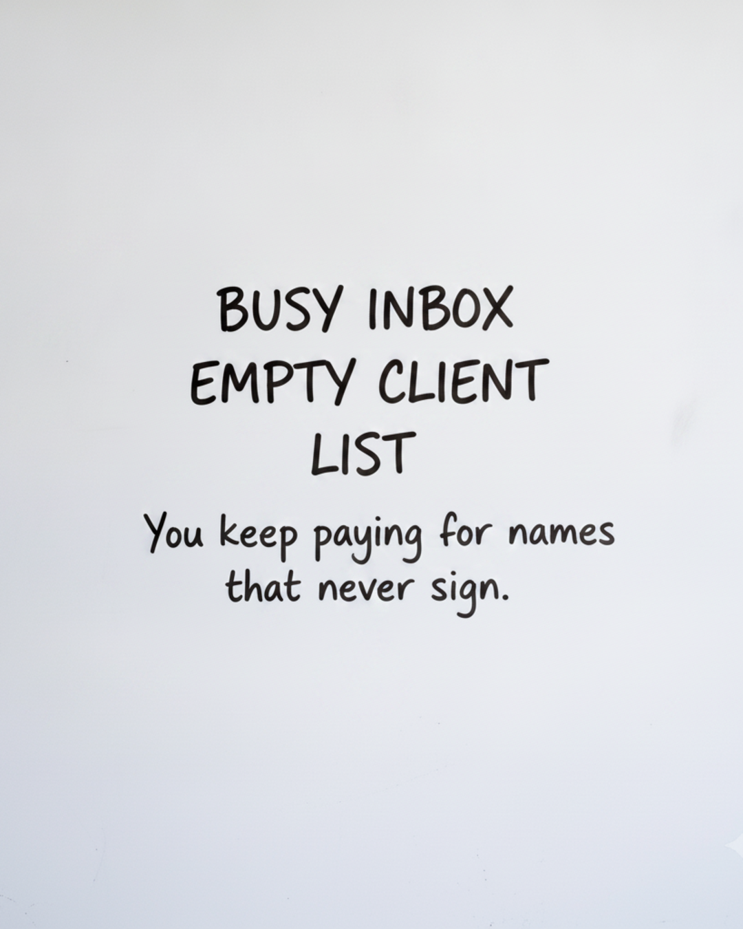 Whiteboard with the words BUSY INBOX EMPTY CLIENT LIST written in black marker