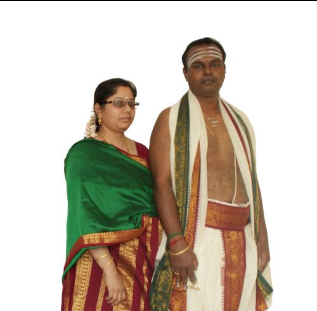 Ritual dress: veshti tied as panchakacham with an angavastram, and a silk sari.