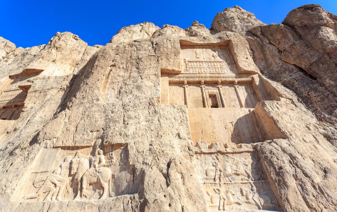 Figure 1. Royal tombs at Naqsh-e Rostam, near Persepolis. Darius I called himself an Aryan in the inscription on his tomb here. The reliefs below were carved by Sasanian kings centuries later.