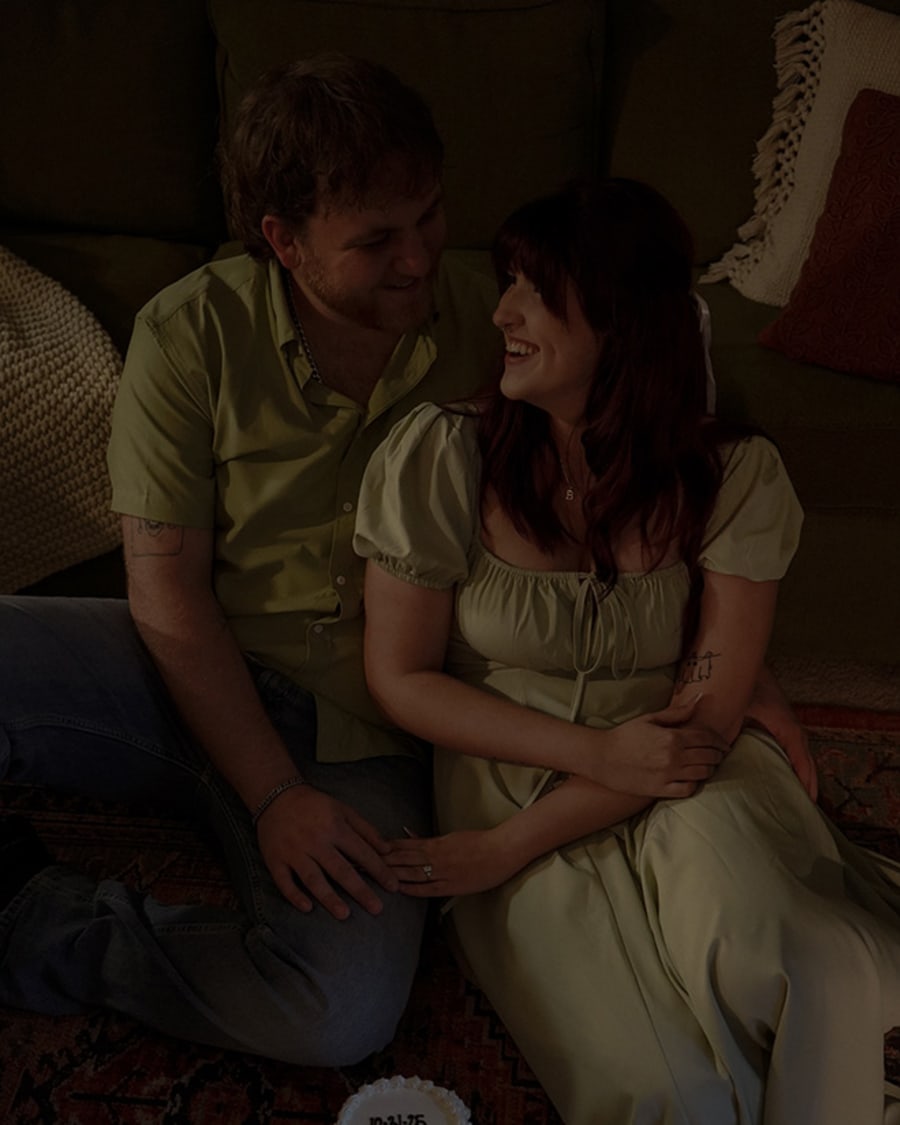 An engaged couple looking into each other's eyes