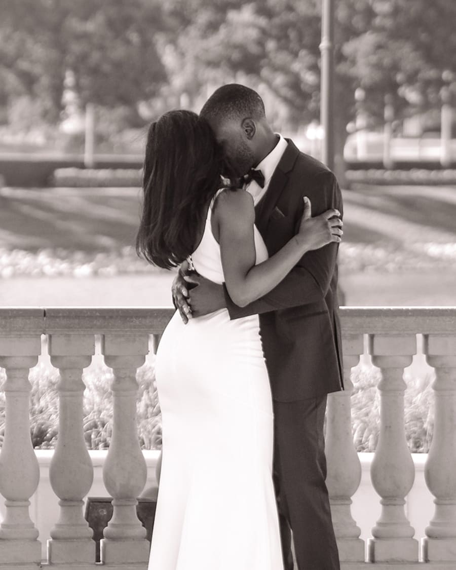A married couple kissing, close up