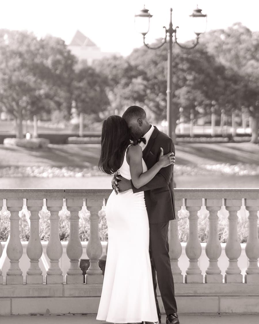 A married couple kissing