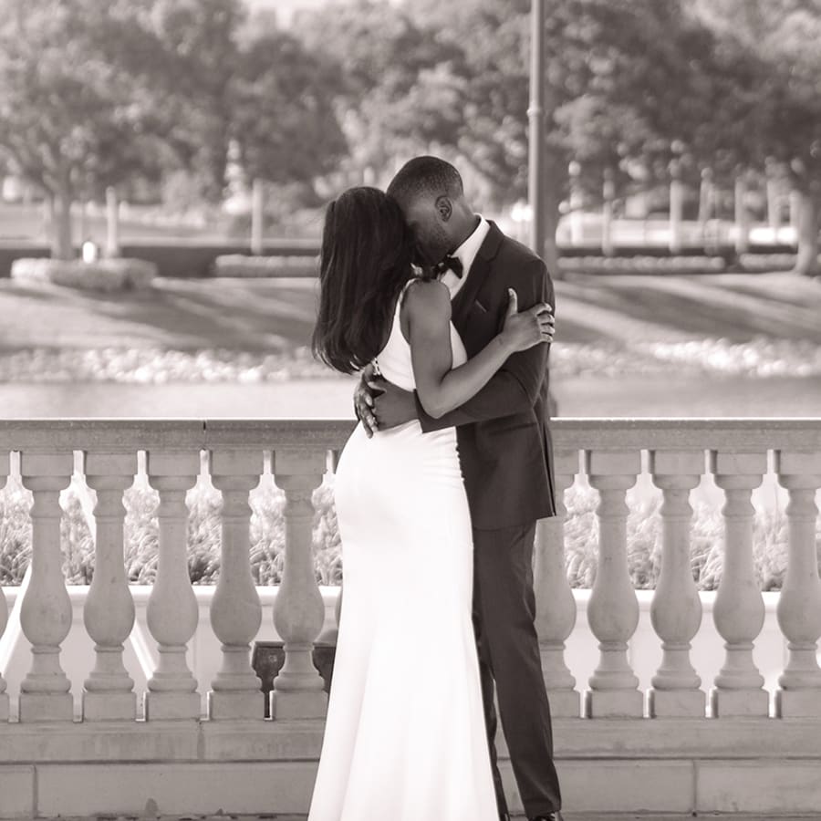 A married couple kissing