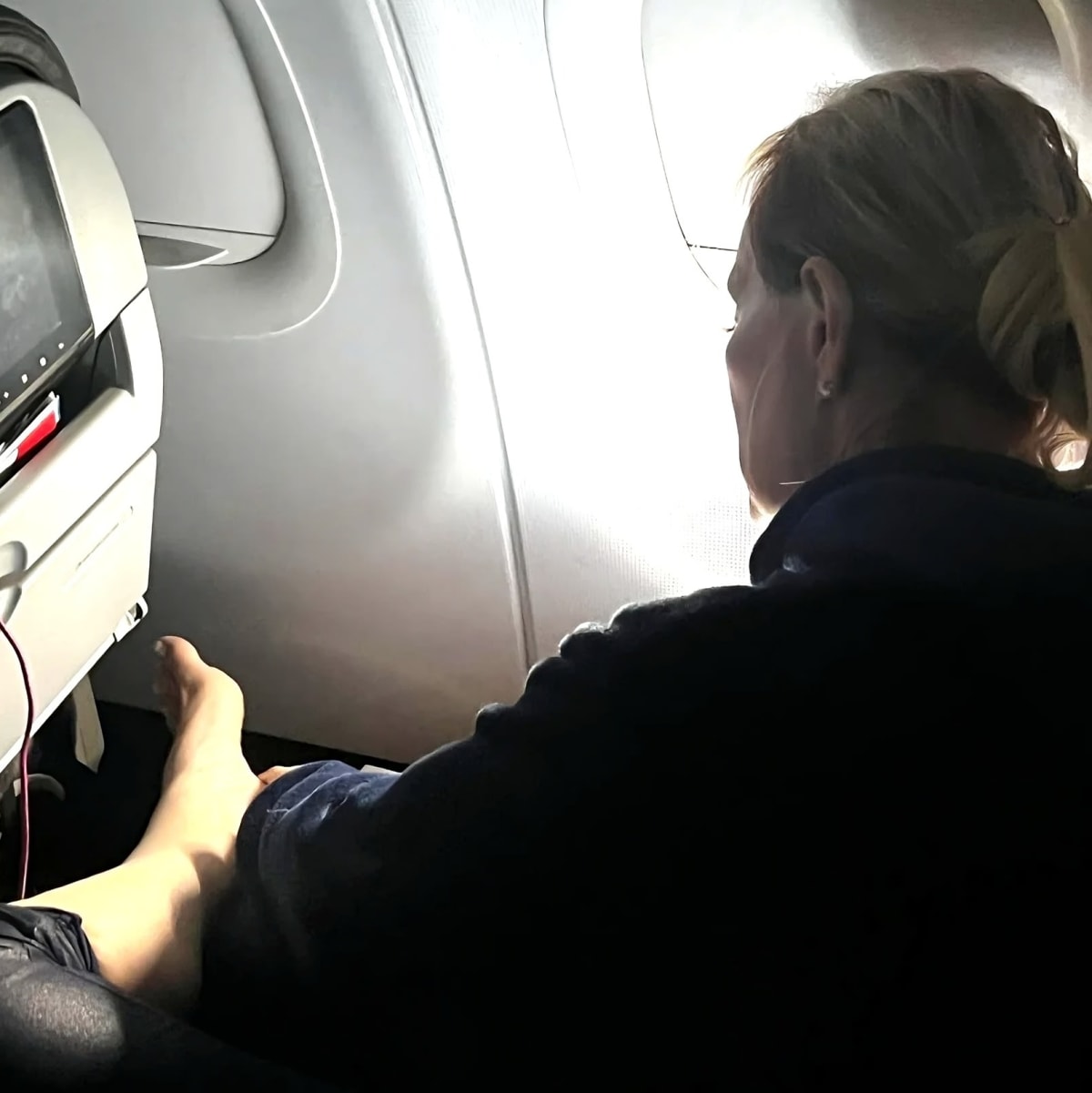 Disgusting Scene On American Airlines: Passenger Grinds Dead Skin Off Feet While Flight Attendant Shrugs