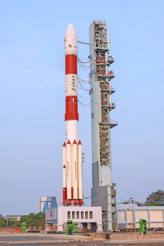 A PSLV rocket standing on the launch pad with its mobile service tower at Sriharikota