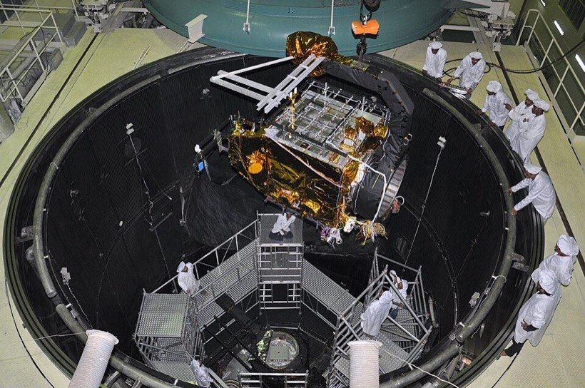 The gold-foil-wrapped Mars Orbiter Mission spacecraft inside a space simulation test chamber
