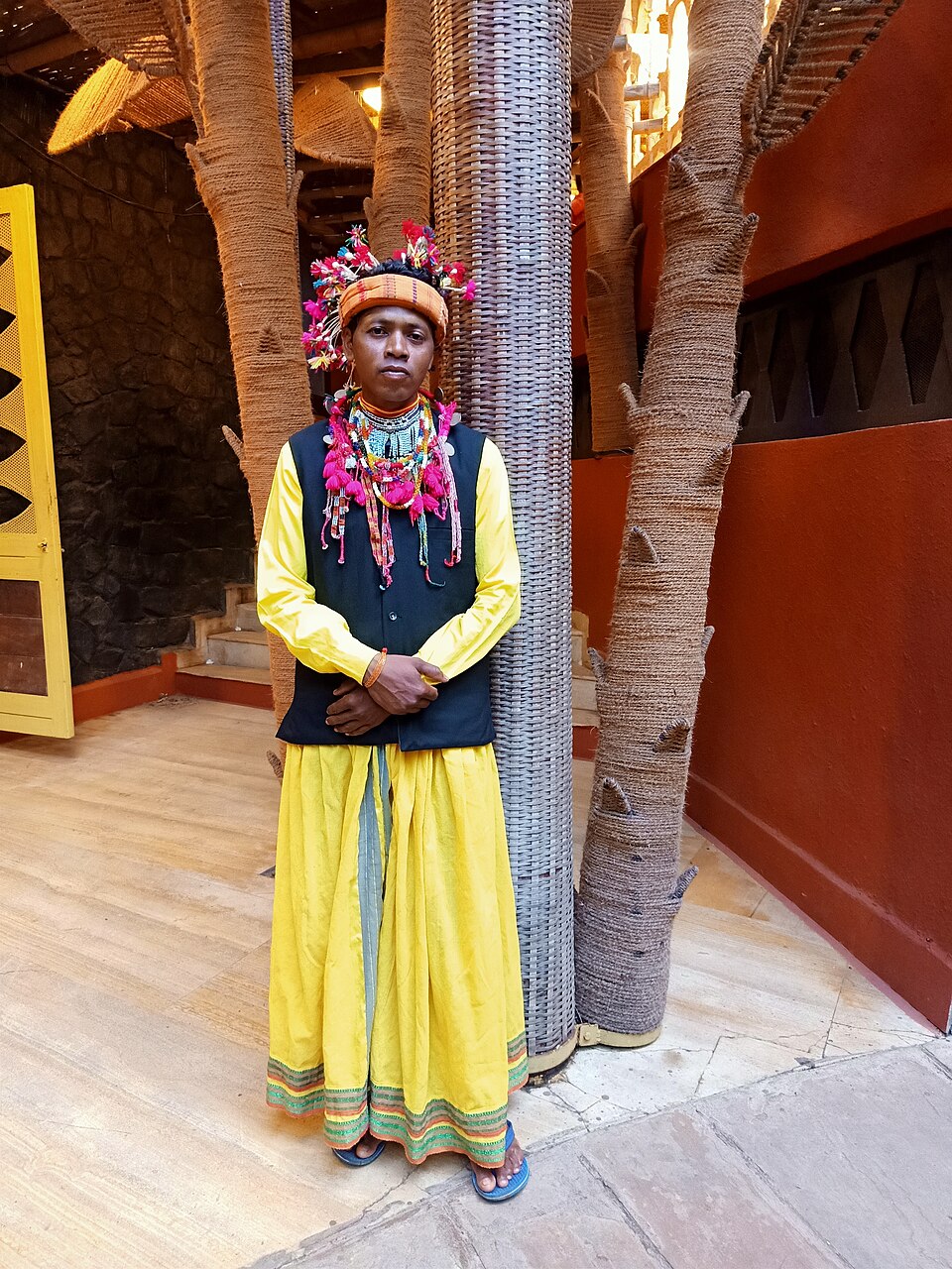 Baiga tribal man of Madhya Pradesh in traditional headdress and beadwork, one of the state's Particularly Vulnerable Tribal Groups covered by Baiga Development Agencies