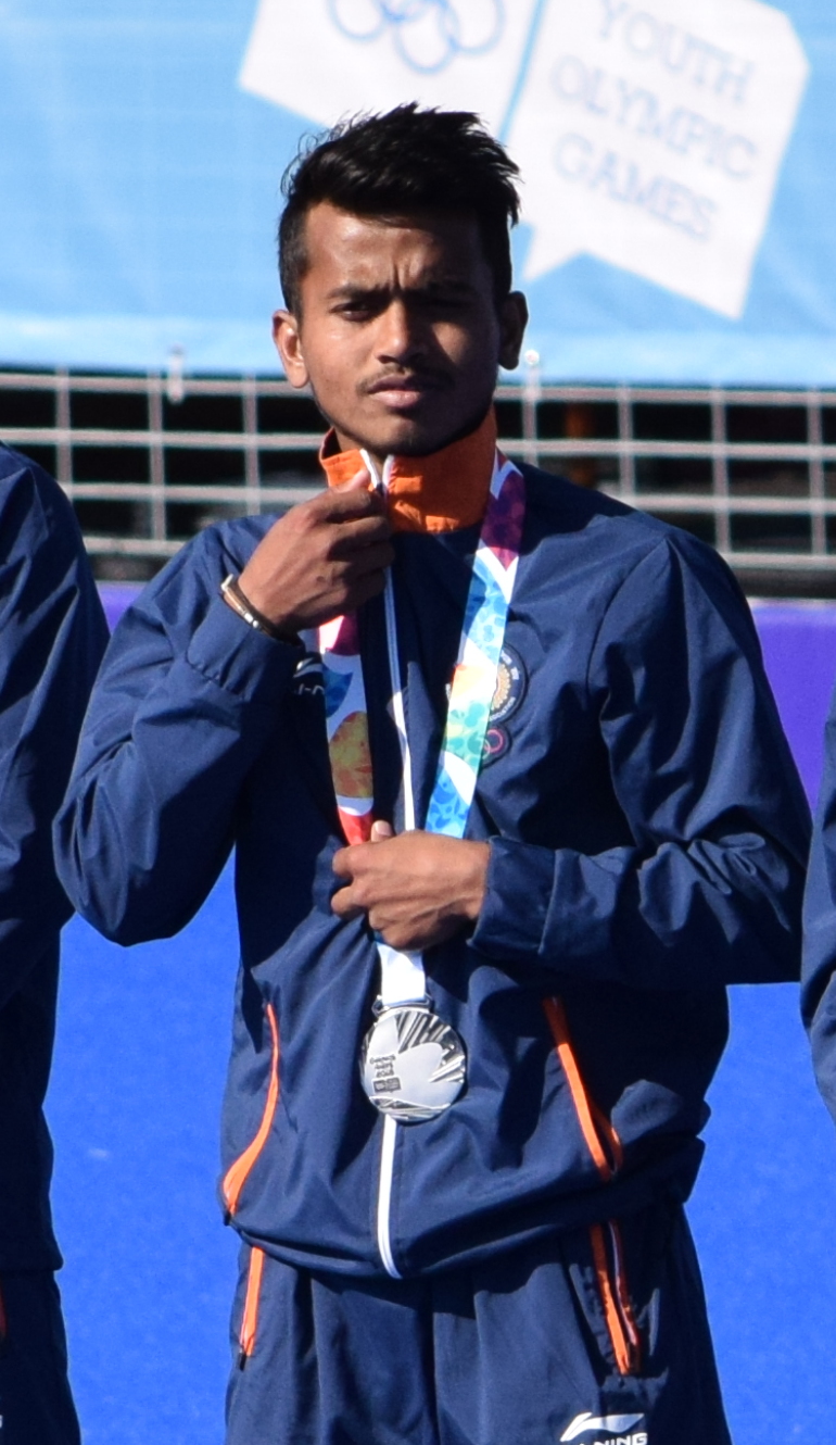 Vivek Sagar Prasad, Madhya Pradesh-born field-hockey midfielder, on the medal podium in India colours