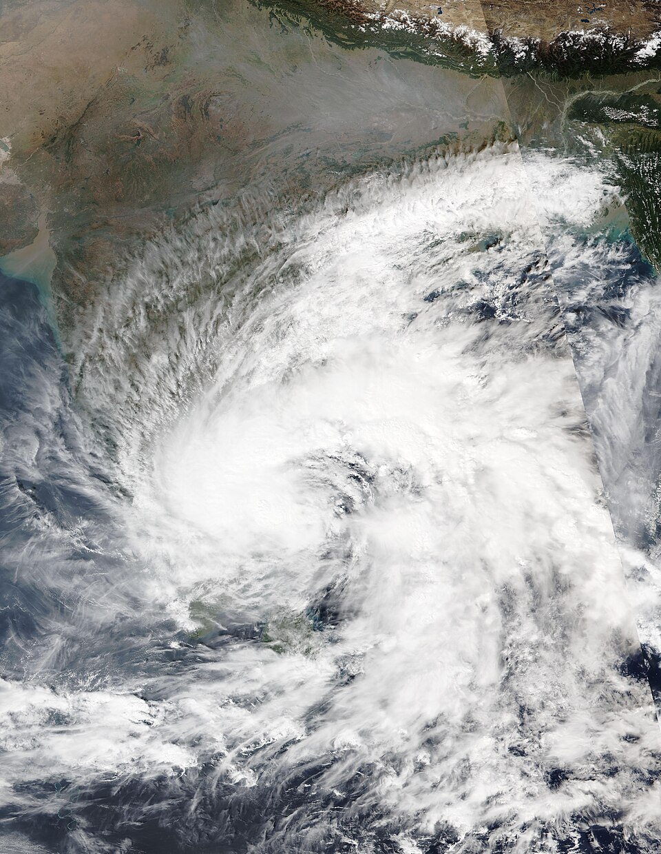 Satellite image of Cyclone Fengal as a broad spiral of cloud over the Bay of Bengal beside the south-eastern coast of India