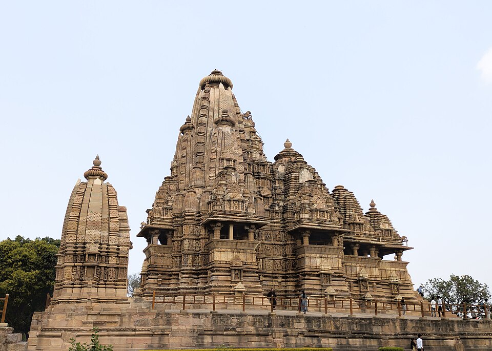 The Kandariya Mahadeva temple at Khajuraho, its clustered sandstone shikhara rising in tiers above a high plinth