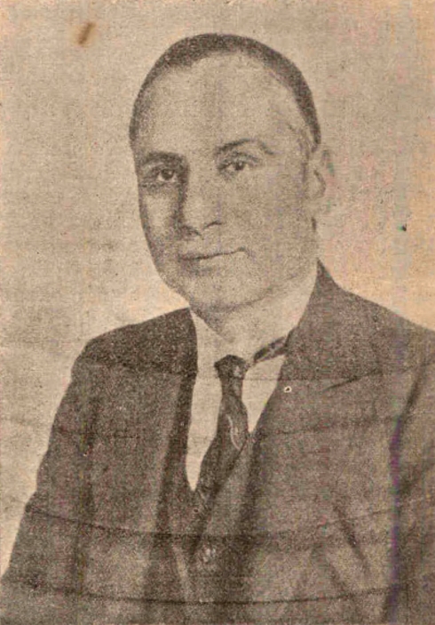 A vintage black-and-white portrait photograph of Sir Tej Bahadur Sapru in a dark suit and tie