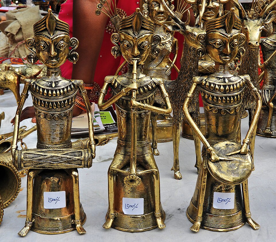Cast-brass Dokra figurines of musician figures, made by lost-wax metal casting, displayed for sale