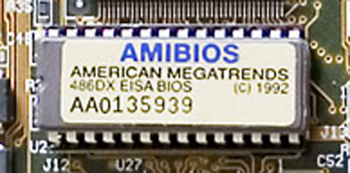An AMIBIOS ROM chip in its socket on a PC motherboard, its label reading American Megatrends 486DX EISA BIOS