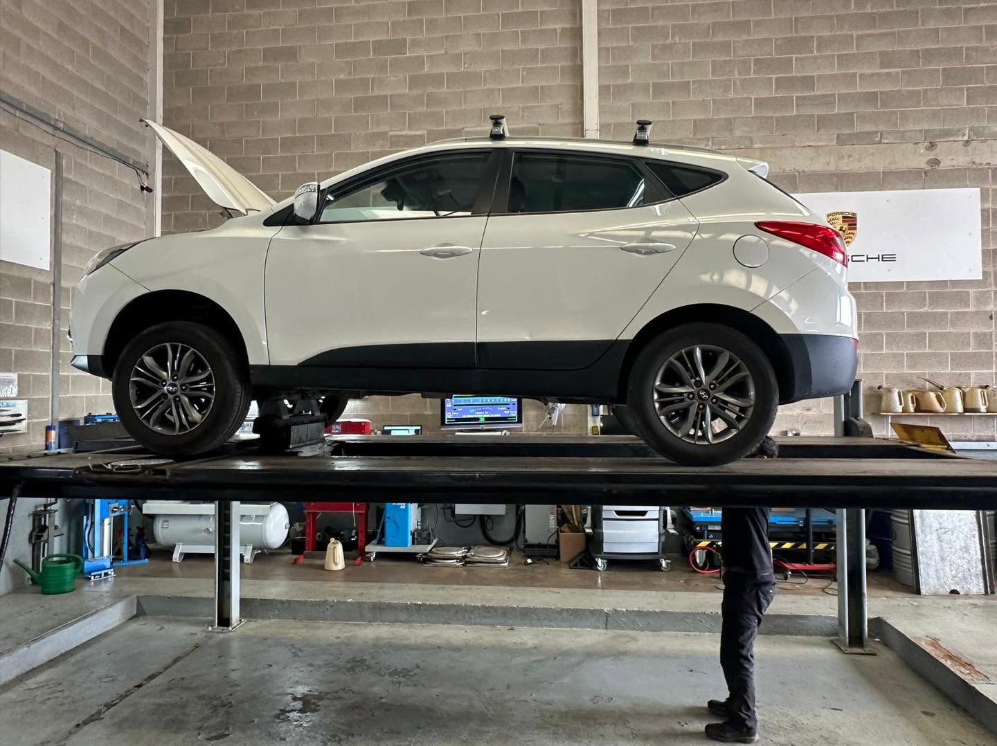 White Hyundai ix35 on the MOT bay lift