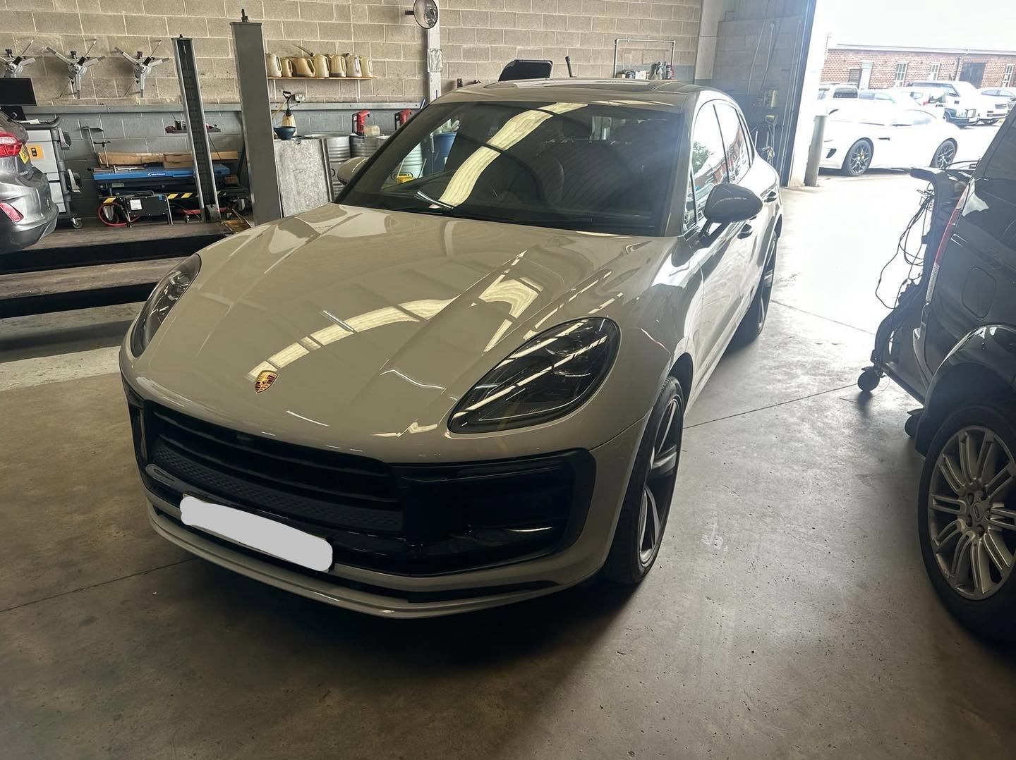 Grey Porsche Macan in the Mitsiland workshop for a service
