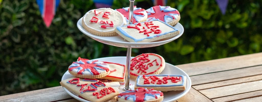 Having a laugh with British slang and mockingly teasing.