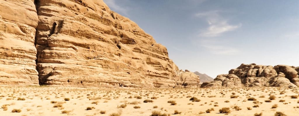 The barren desert was bone-dry and arid.