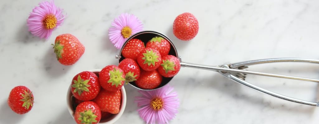 The bowl was filled with bright red cherries.