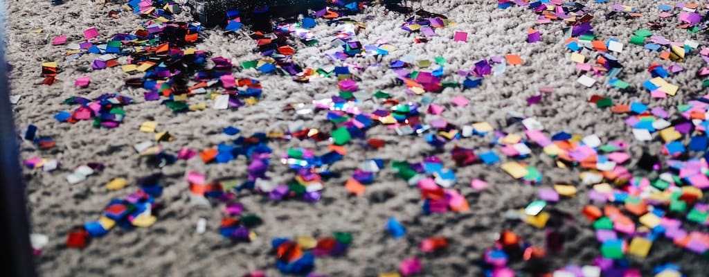 Clean the broken glass off the floor.
