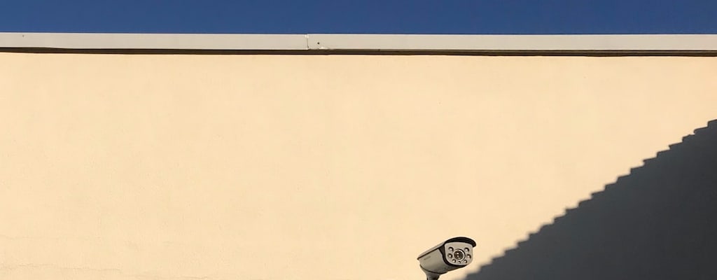 He kept a watchful eye on the security cameras.