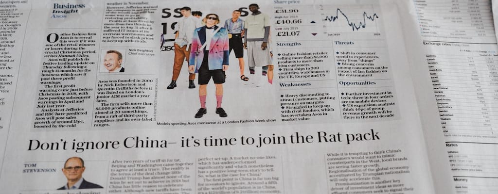 Breaking news interrupts the newspaper with an update.