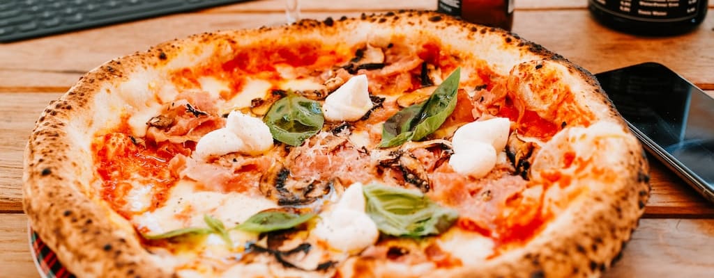 Place the pizza on the table.
