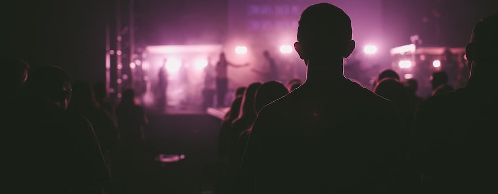 The actor commanded the stage in the spotlight.