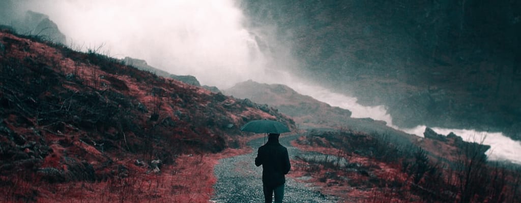 The sky cried tears of sadness, pouring rain.