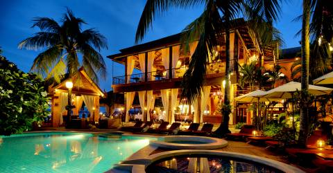 Zazen Boutique Resort & Spa Swimming Pool _ Restaurant by night.jpg