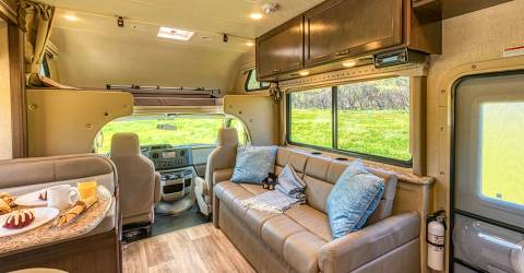 usa c28-30 road bear rv inside sofa sleeping area above front seats.jpg