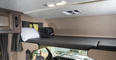 usa-cruise-america-c25-inside-sleepinng-area-above-front-seats-night.jpg