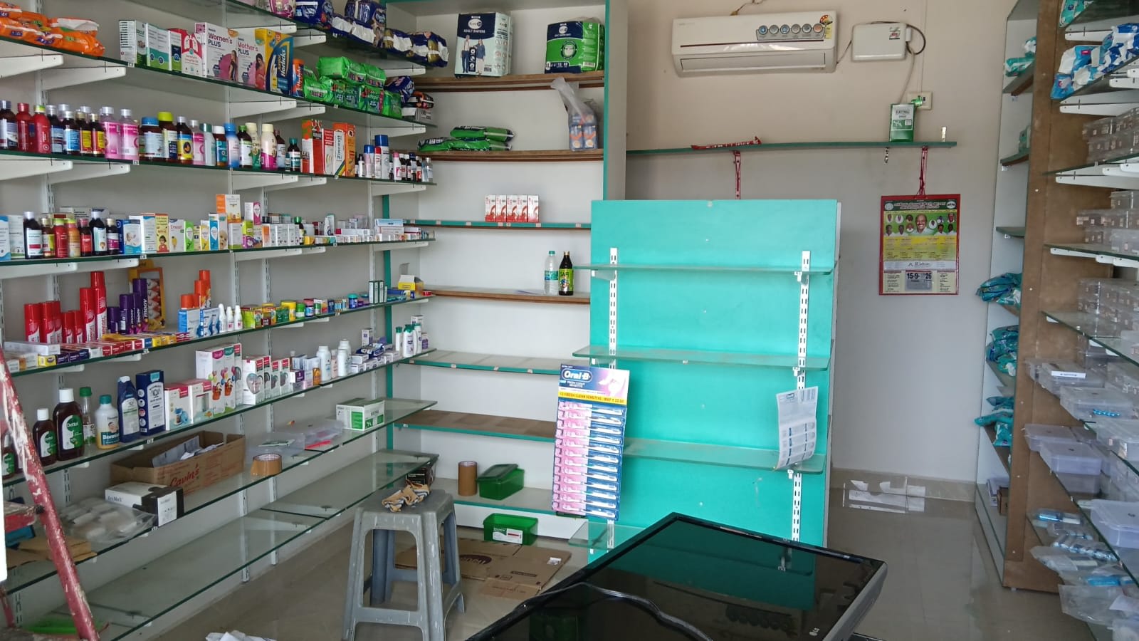 Pharmacy glass racks, fridge, AC, CCTV, computer table, counter table dot matrix printer etc - Thumbnail 3
