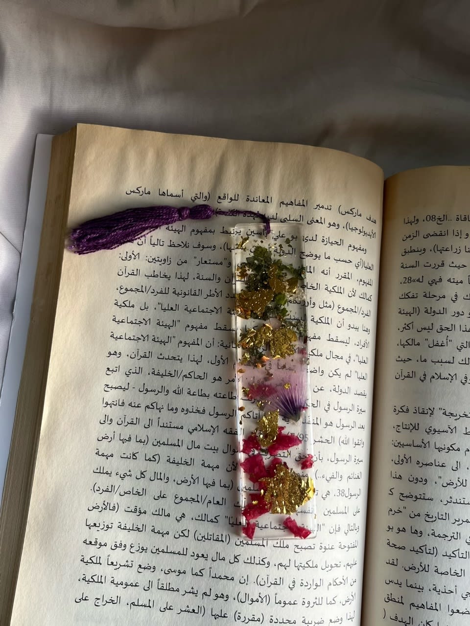 A handmade resin bookmark with real flowers 