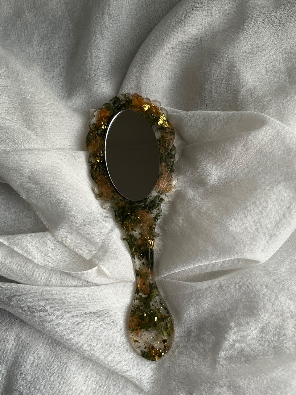 Mirror with a forest inspired theme, made with resin & real flowers