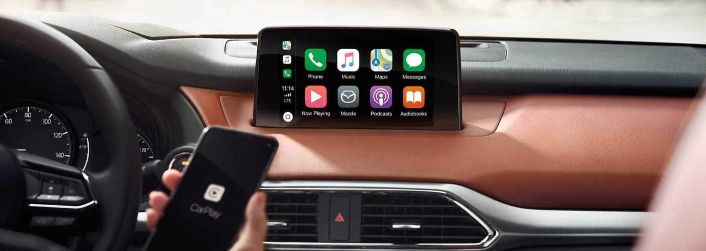 Wireless Apple CarPlay setup in modern car dashboard