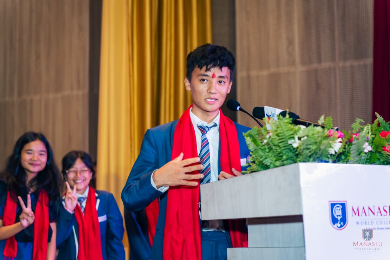 Phurba giving a speech at college