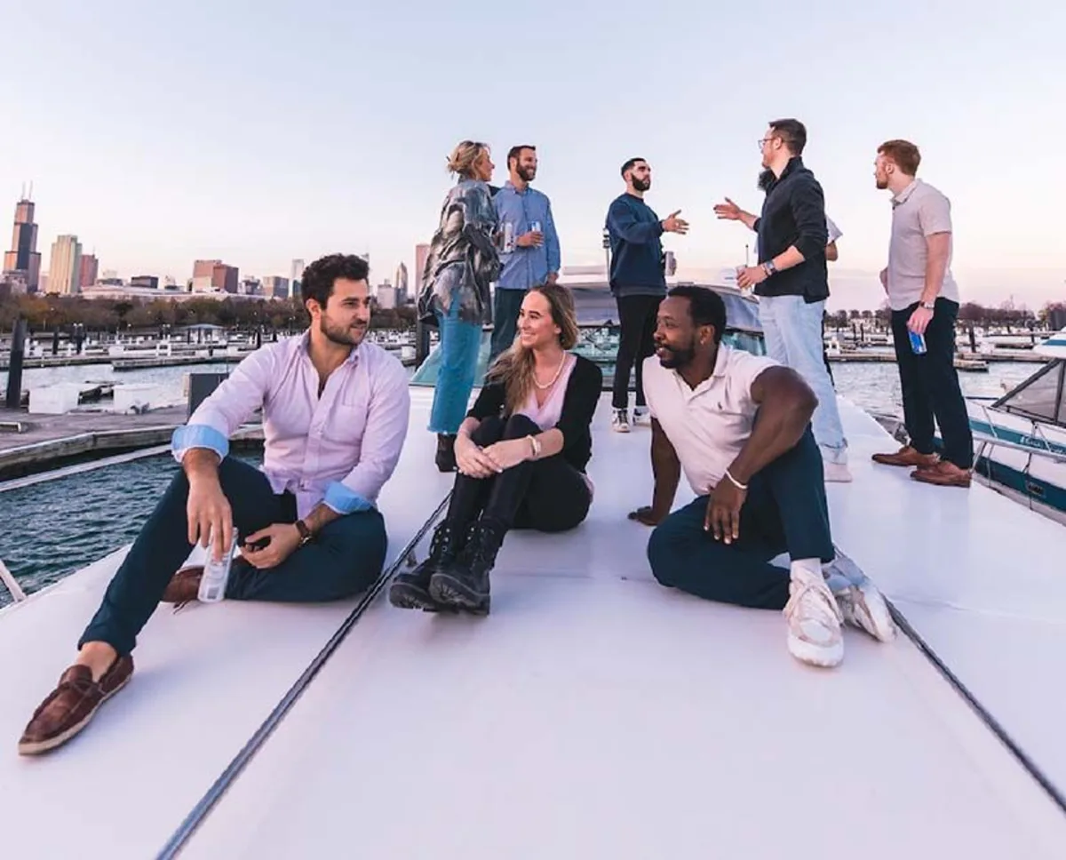 Knot My Boat Charters members sitting on front of the boat
